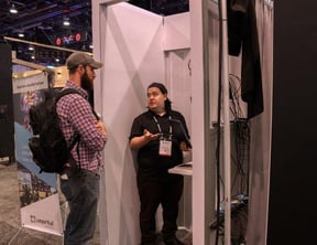  A Userful employee demos the Userful platform to a man at Infocomm 2018