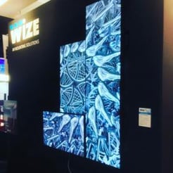 Wize-AV mounting solutions booth with advertisement on video wall at ISE 2017 Amsterdam