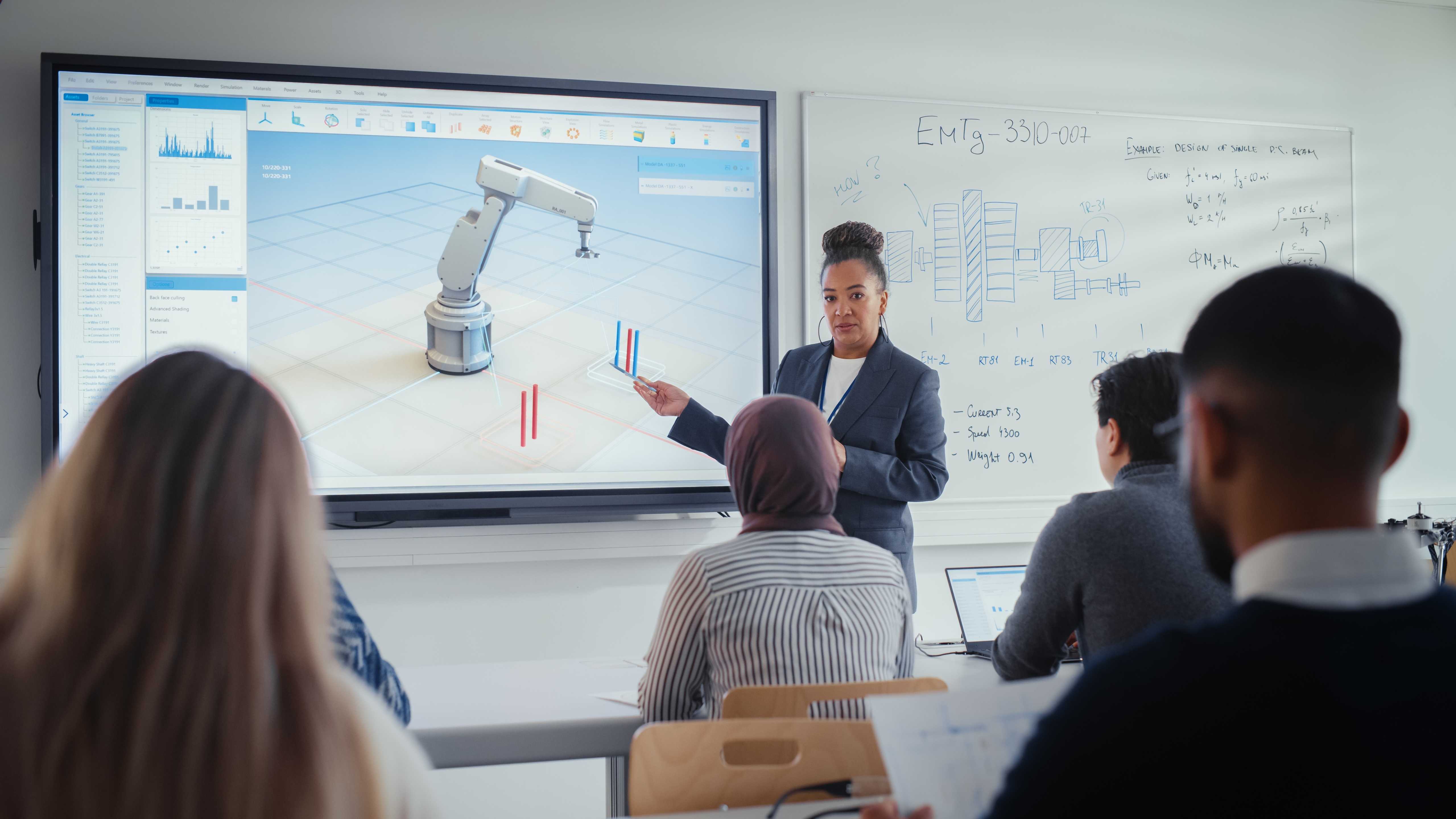 students looking at screen while teacher presents
