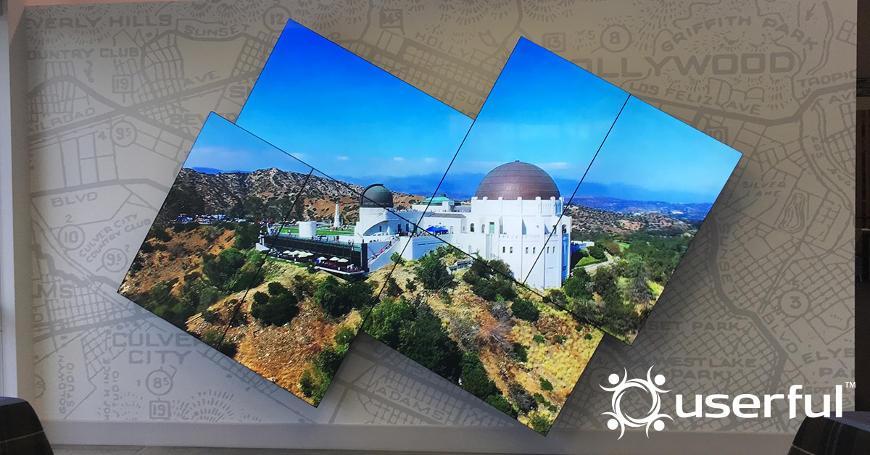 Artistic mosaic video wall displaying a photo of the Griffith Observatory, white Userful logo in the bottom right corner
