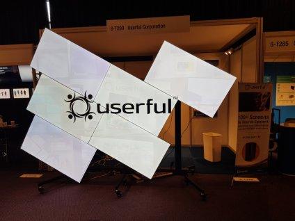 A mosaic video wall at ISE 2018 Amsterdam displaying the Userful logo