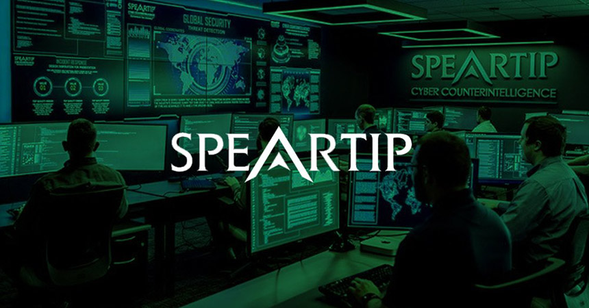 Speartip Cyber Counterintelligence security operations center with video walls displaying data, and workers at workstations with green overlay and logo